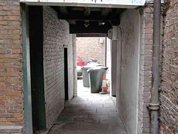 passage (or snickelway) leading through to the yard.