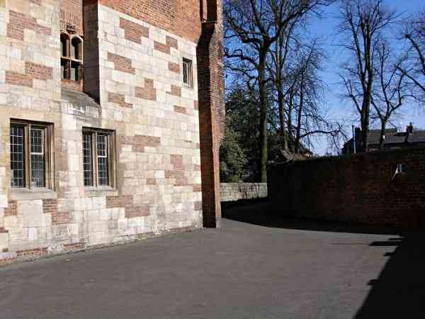 Looking along the lane and the medieval abbey wall towards Exhibition Square and Bootham Bar..